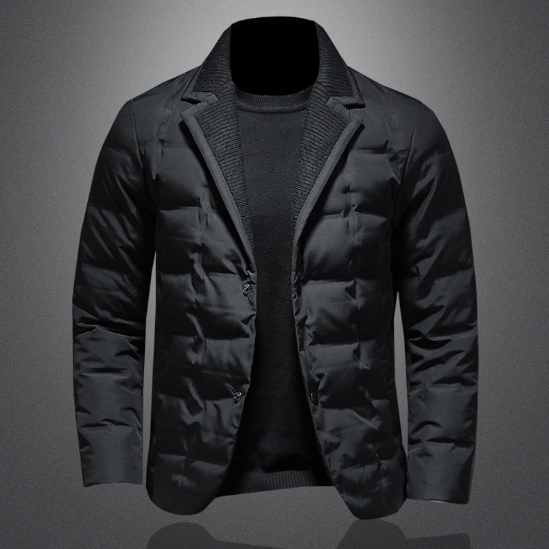 Black puffer jacket on a gray background