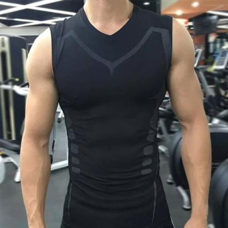 A person wearing a black sleeveless compression vest in a gym setting.