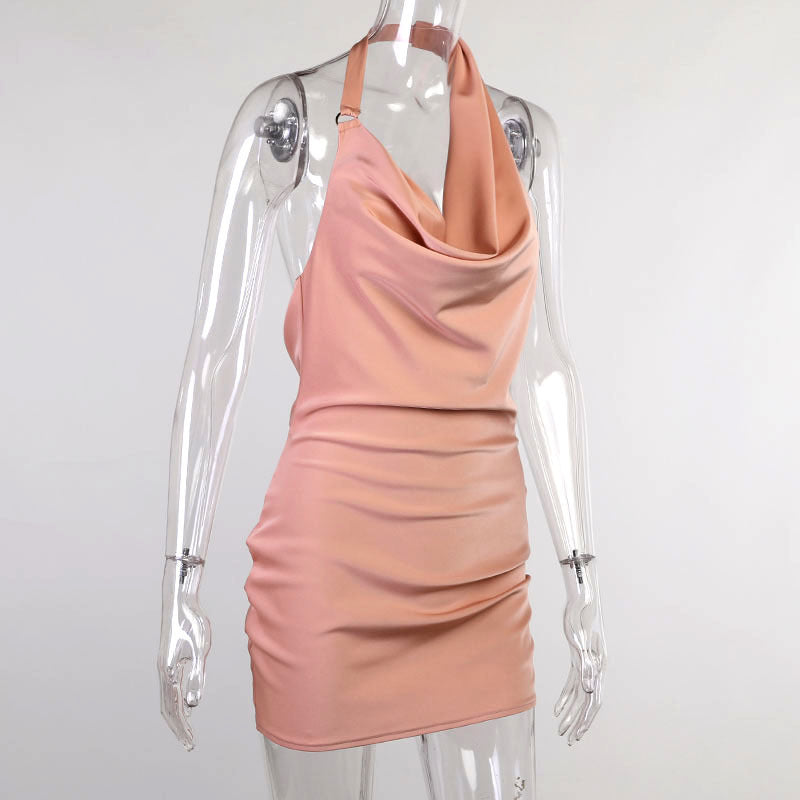 Pink halter neck dress on a transparent mannequin against a white background