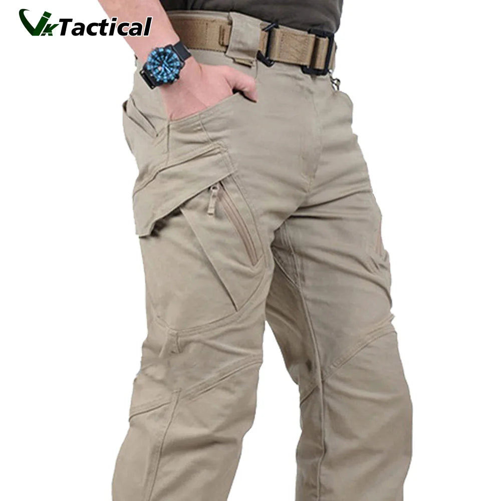 A pair of beige VikTactical cargo pants with multiple pockets, displayed on a male model.