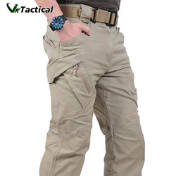 A pair of beige VikTactical cargo pants with multiple pockets, displayed on a male model.