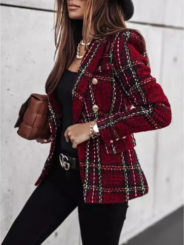 Person wearing a red plaid jacket with a blurred background