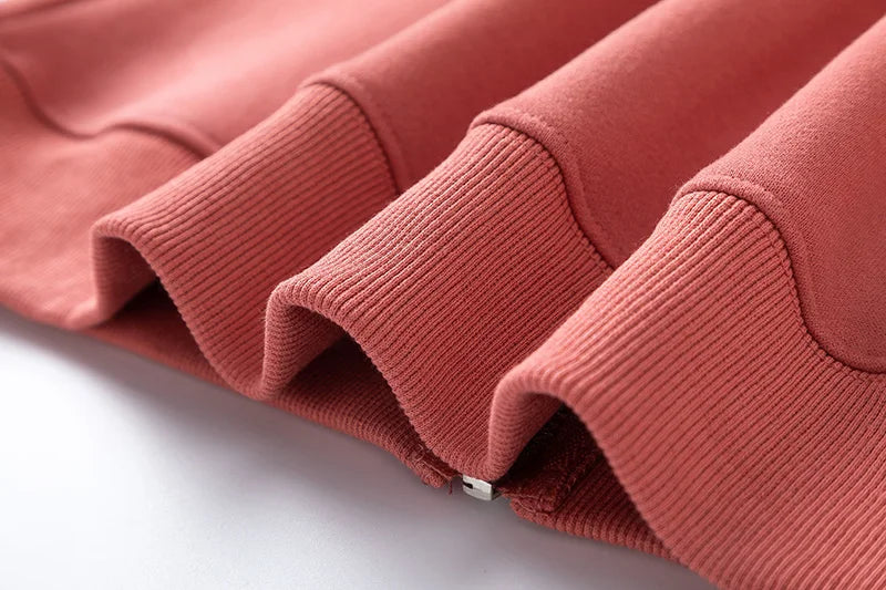 Close-up of a folded pink garment on a white background