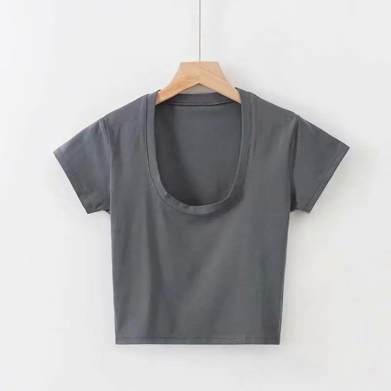 Gray t-shirt on a wooden hanger against a white background