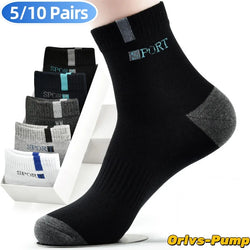 Black socks with gray toes and heels, featuring a brand logo, on a white background.
