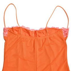 Orange top with pink lace trim on a white background
