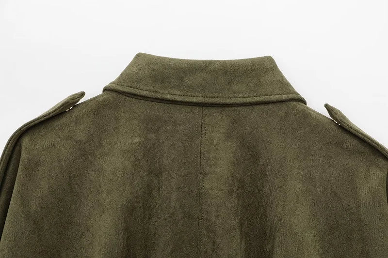 Close-up of a green suede jacket on a white background