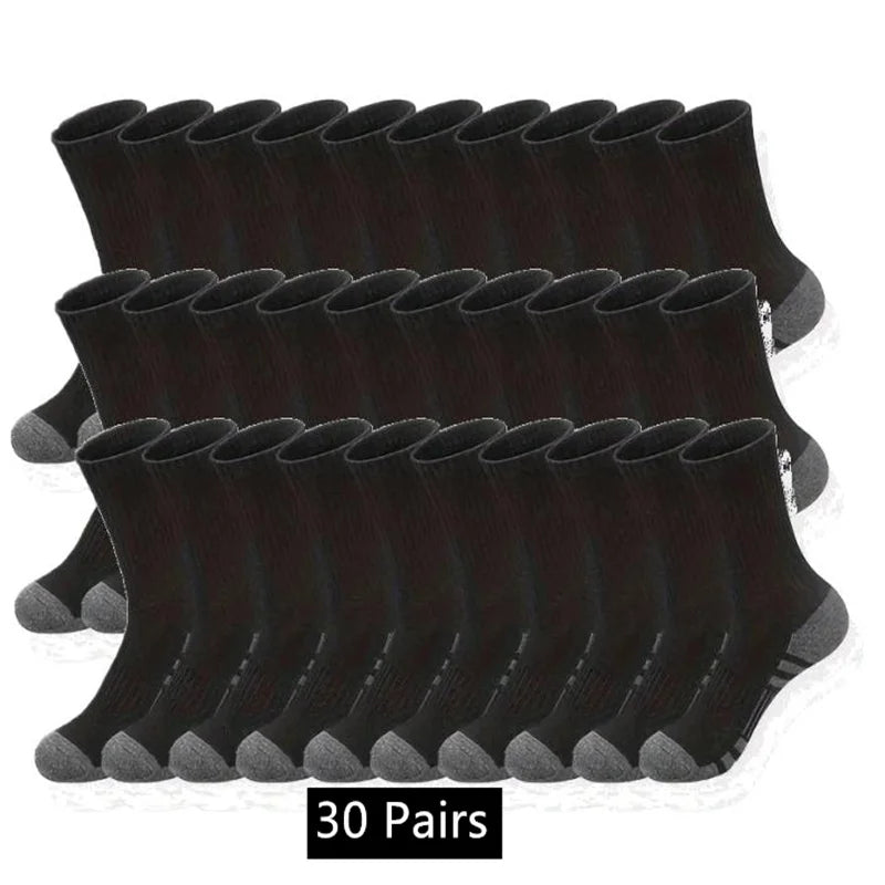 Black sock with brown accents on a white surface.