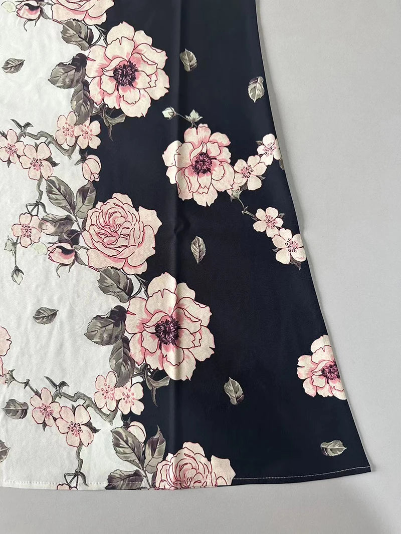 Floral fabric with pink flowers on a dark background