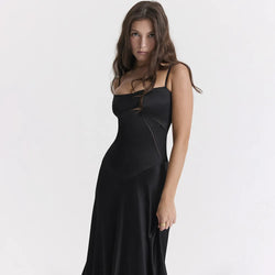 Woman wearing a black dress on a white background