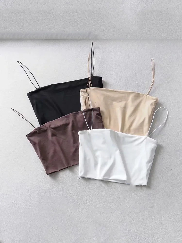 A collection of women's crop tops in various colors including beige, black, brown, white, and purple, displayed against a neutral background.