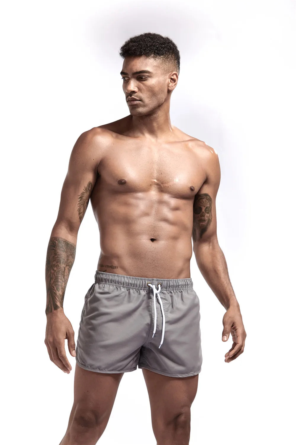 Man wearing gray shorts on a white background