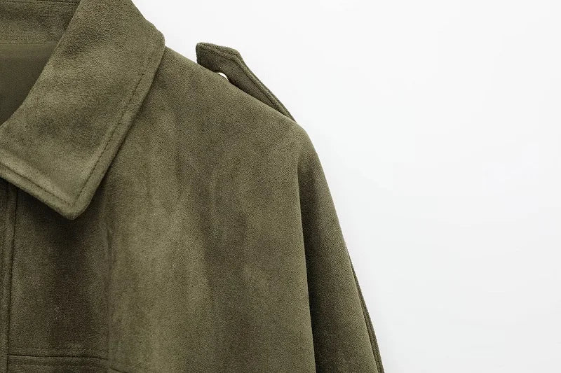 Close-up of a green suede coat on a white background