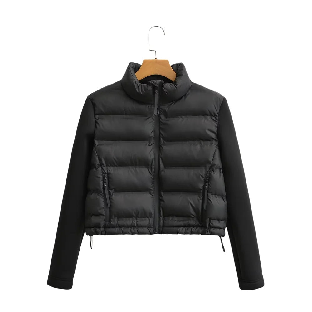 Black puffer jacket on a wooden hanger against a white background