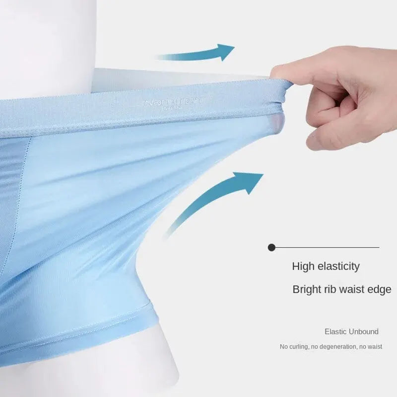 Blue underwear with a hand stretching it to demonstrate elasticity, on a white background.