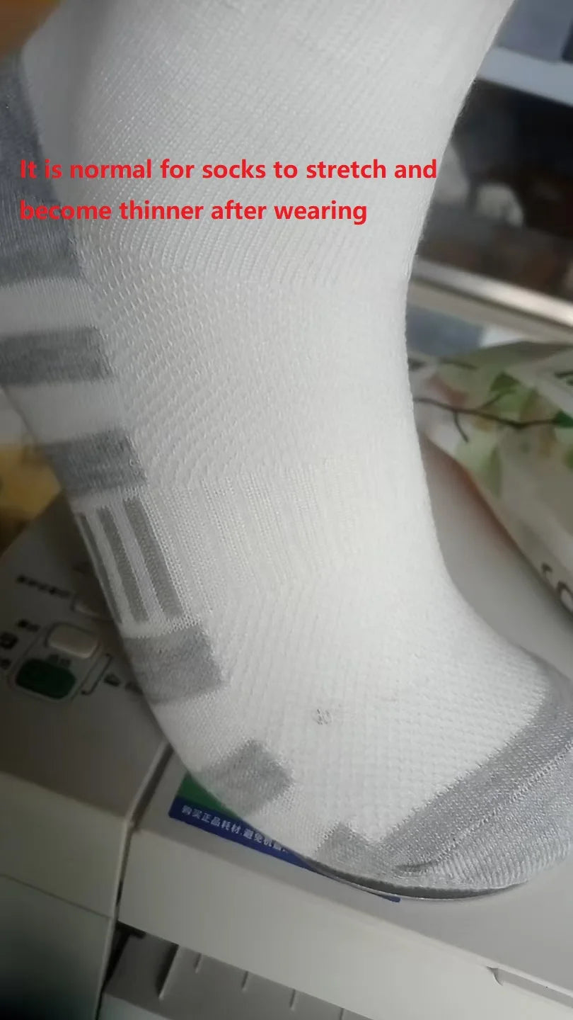 White sock with gray accents on a white surface, with text indicating normal stretching and thinning after wearing.