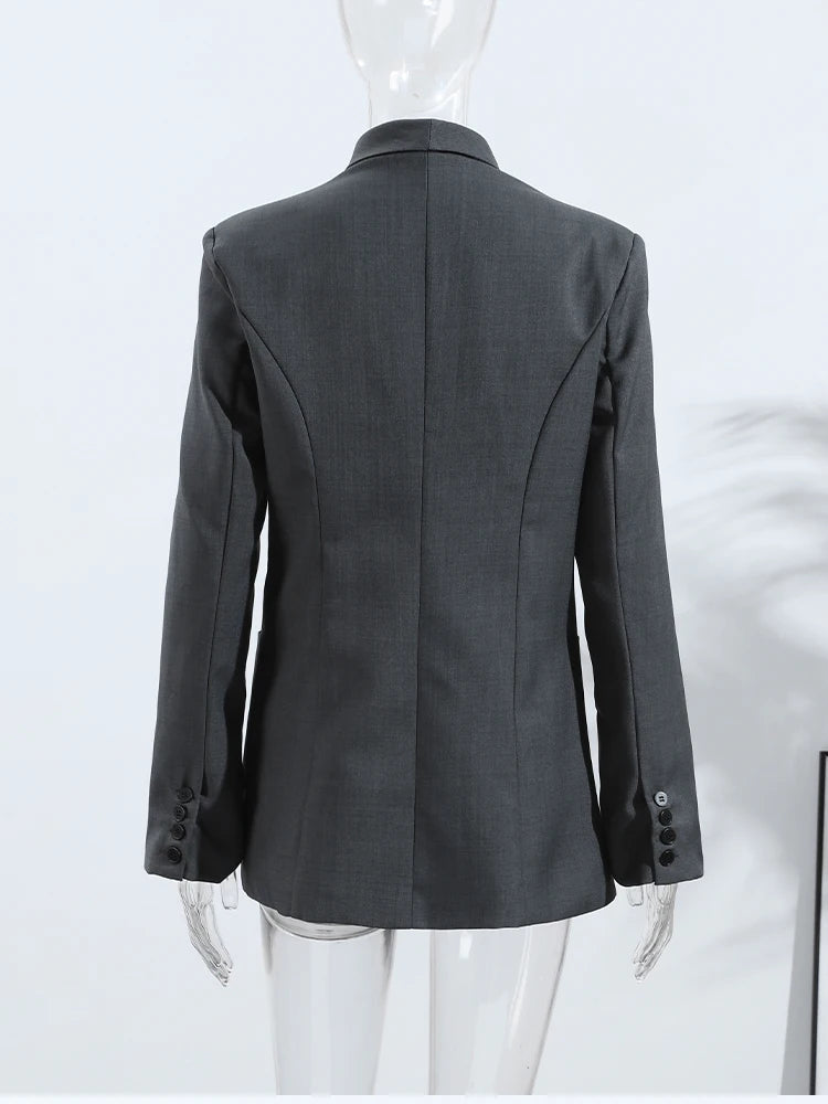 Gray blazer on a mannequin against a white background