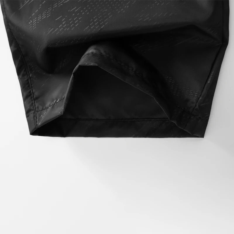 Close-up of a black fabric texture on a white background