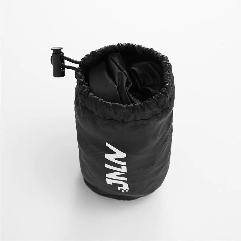 Black drawstring bag with a handle on a white background