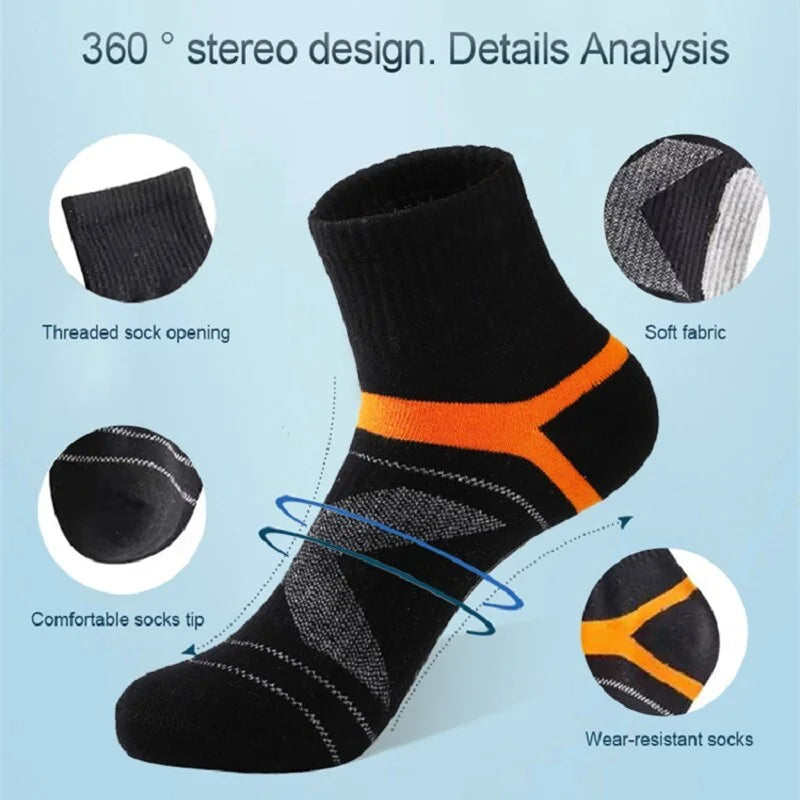 Black sock with orange accents on a light blue background, showing features like threaded opening and wear-resistant sole.