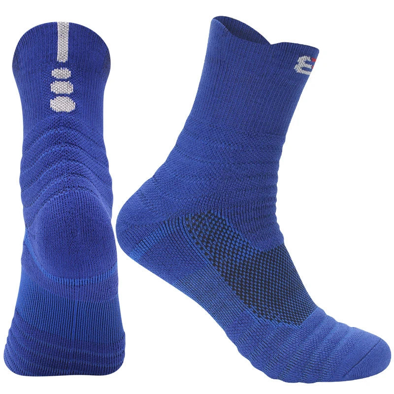 Pair of blue athletic socks with textured soles on a white background