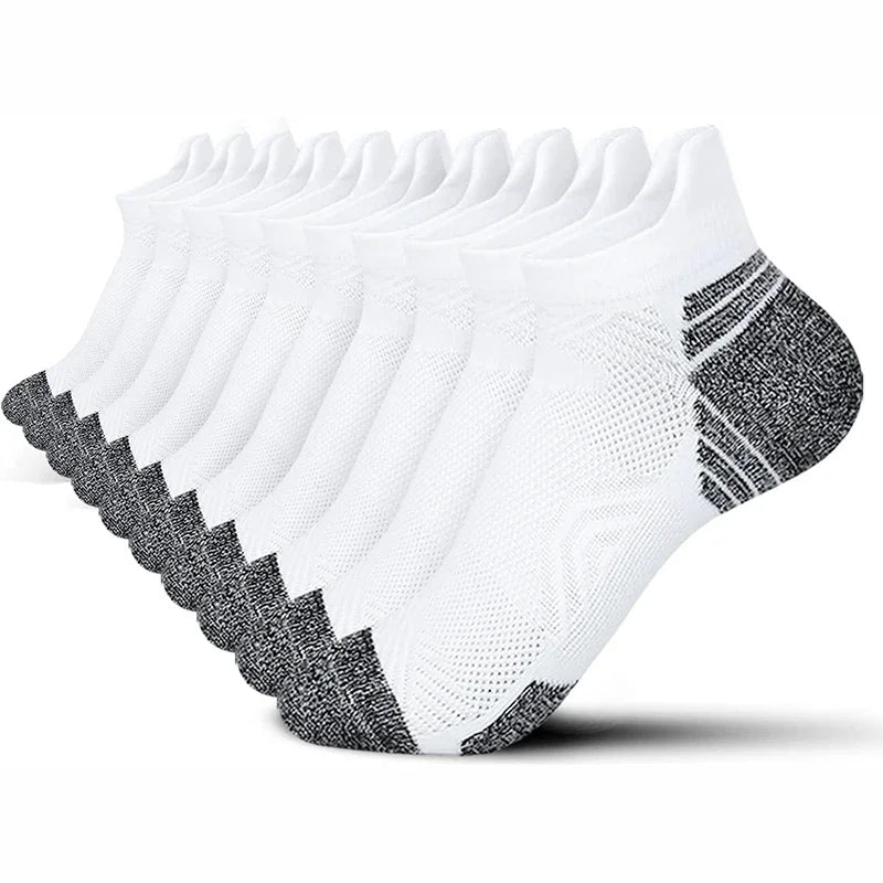 Set of six white ankle socks with gray toes and heels on a white background