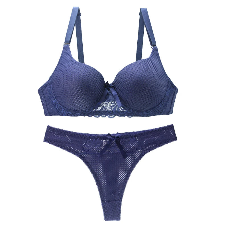 Blue lace push-up bra and thong set with underwire on a white background