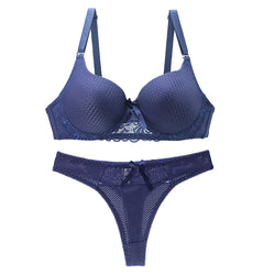 Blue lace push-up bra and thong set with underwire on a white background