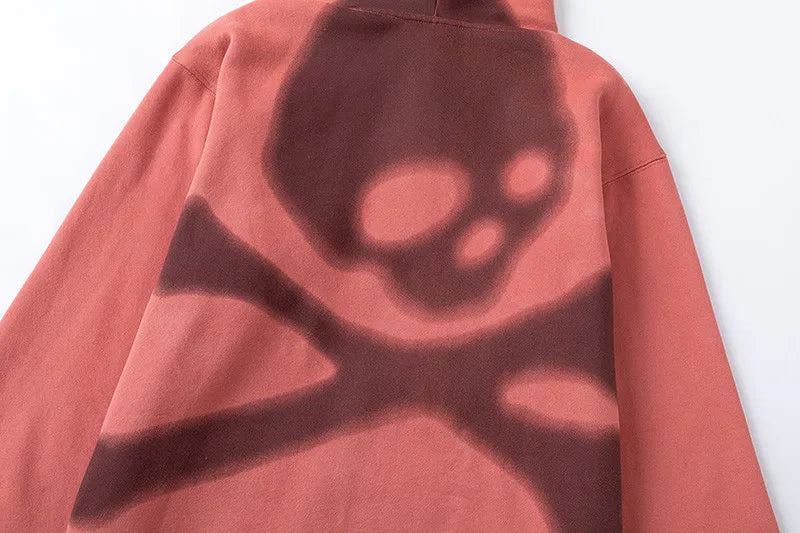 Red sweatshirt with a black abstract design on a white background