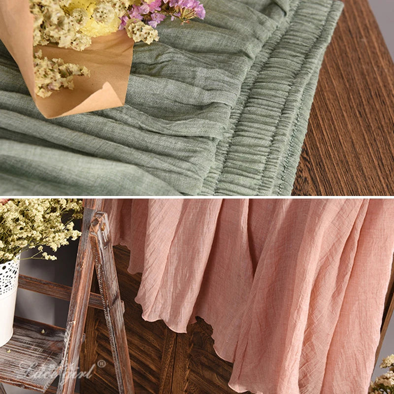 Top: Green textured fabric with flowers on a wooden surface. Bottom: Pink fabric draped over a wooden ladder.