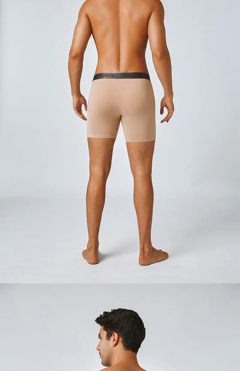 Man wearing beige men's underwear on a white background