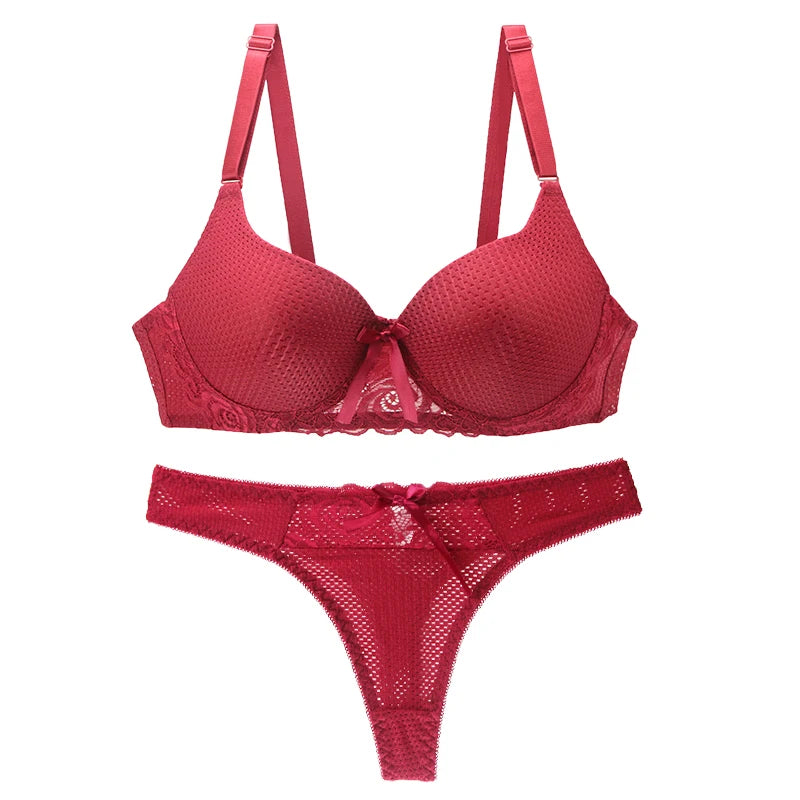 Red lingerie set with bra and panties on a white background