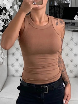 A woman wearing a brown solid round neck ribbed tank top.