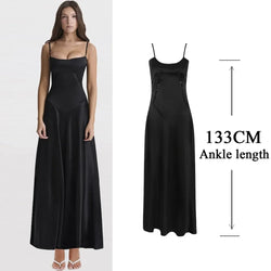 Black dress displayed on a model with an annotation indicating the length.