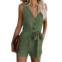 Green romper worn by a model on a white background