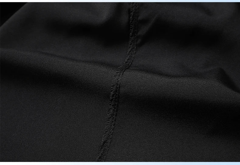 Close-up of black fabric with a visible seam
