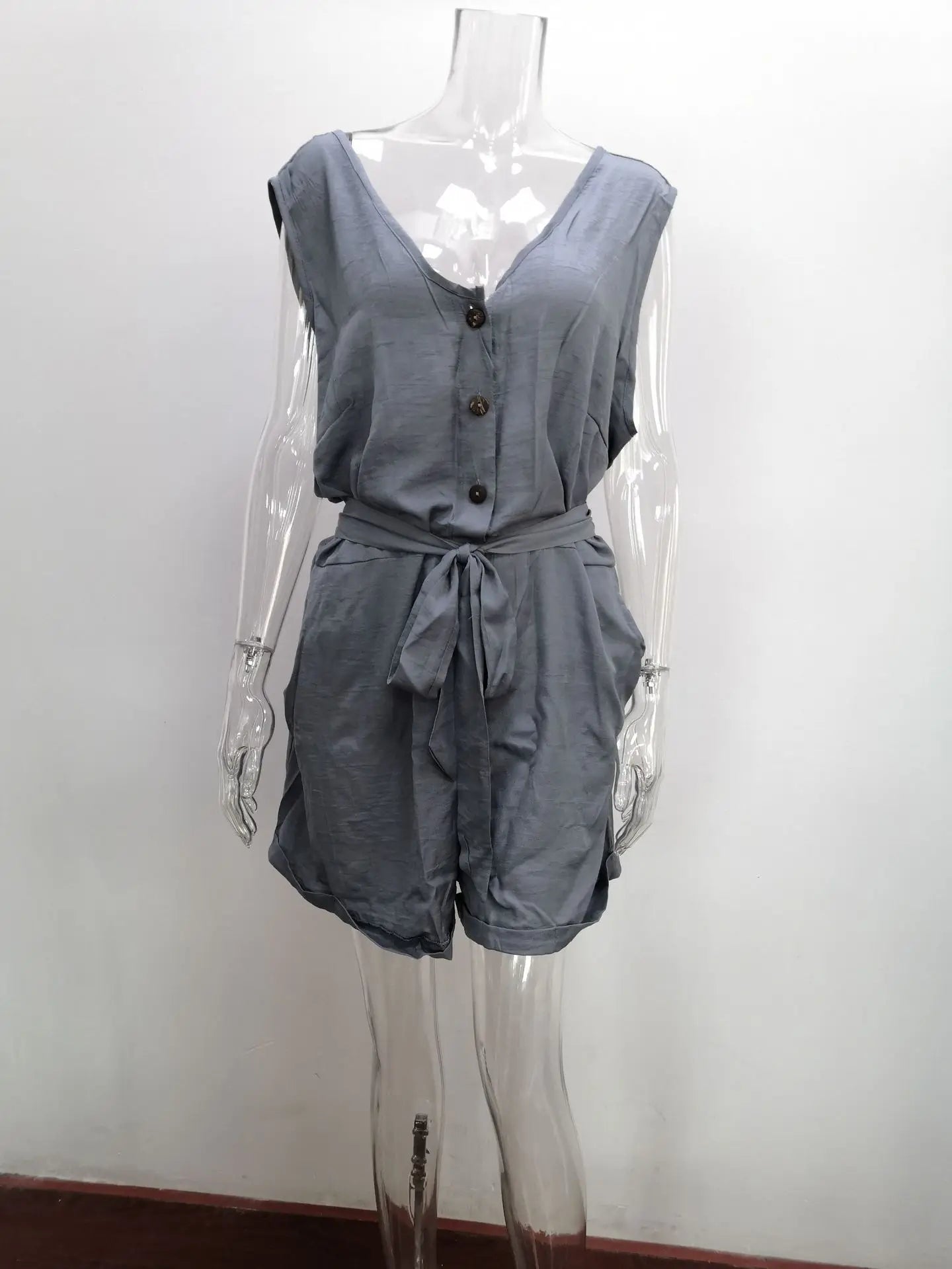 Gray sleeveless romper on a mannequin against a white background