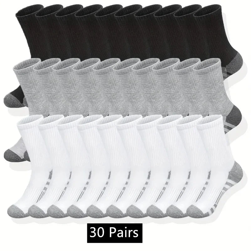 30 pairs of black, gray, and white socks on a white background