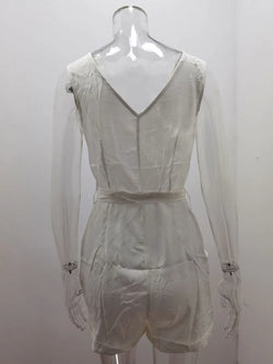 Sheer white romper on a mannequin against a white background