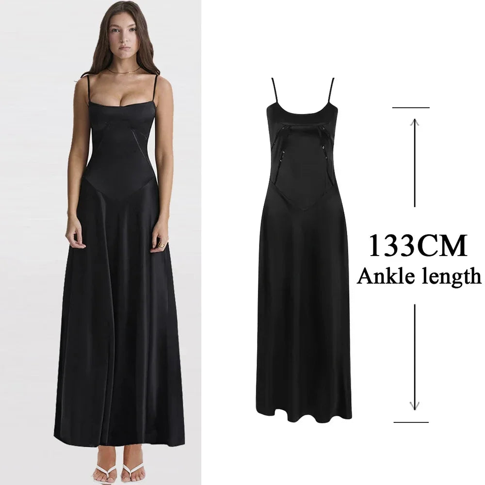 Black dress with measurement label on a white background