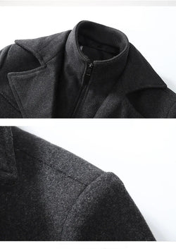 Close-up of a dark gray coat with a collar on a white background