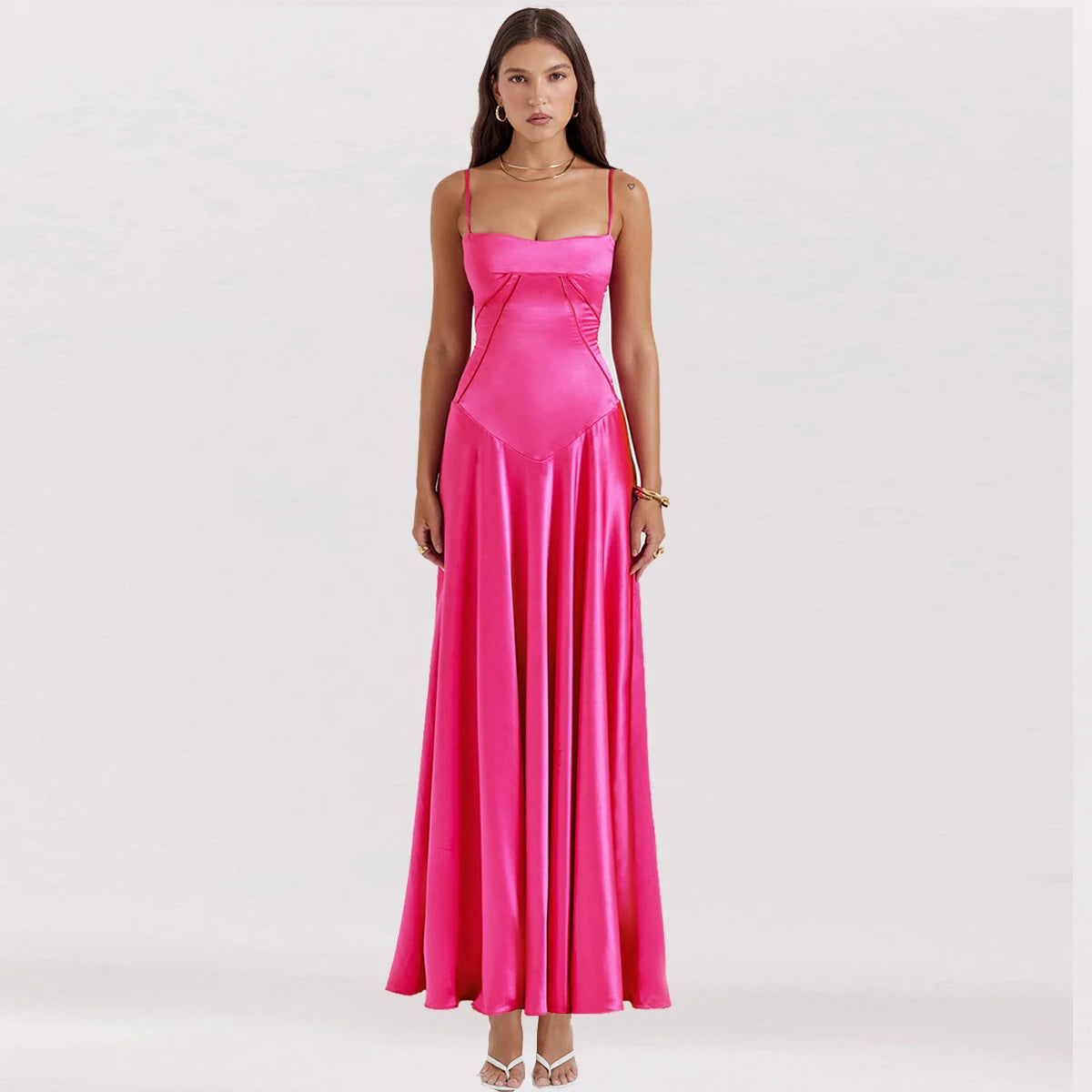 Woman wearing a pink evening gown on a white background