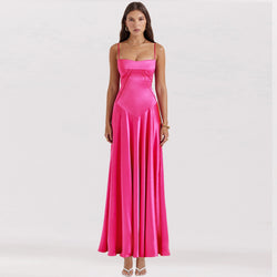 Woman wearing a pink evening gown on a white background