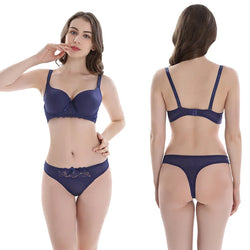 Woman wearing a blue bra and panties set, shown from front and back on a white background.