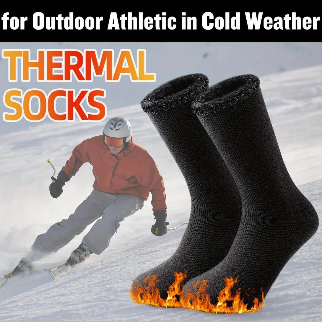 Black thermal socks with flame design on a snowy background, featuring a skier.