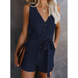 Navy blue romper worn by a person against a neutral background