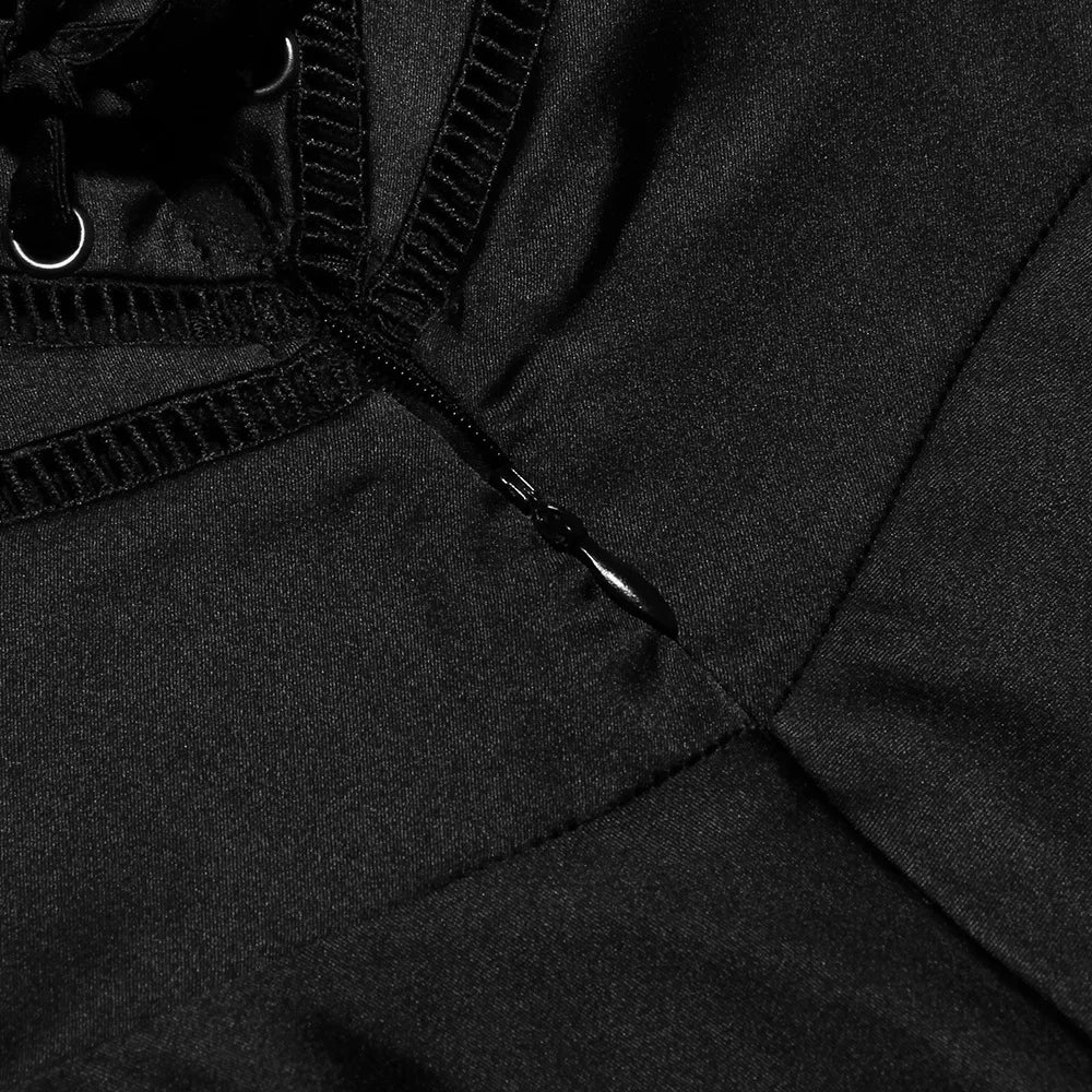 Close-up of a black jacket with a zipper and hood details.