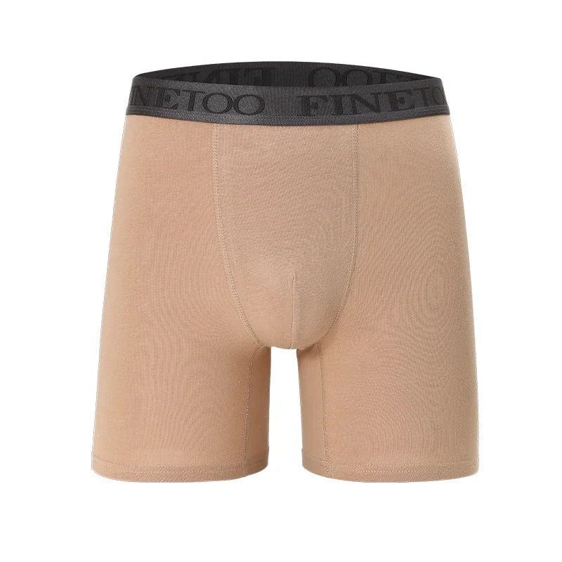 Beige boxer briefs with black waistband on a white background