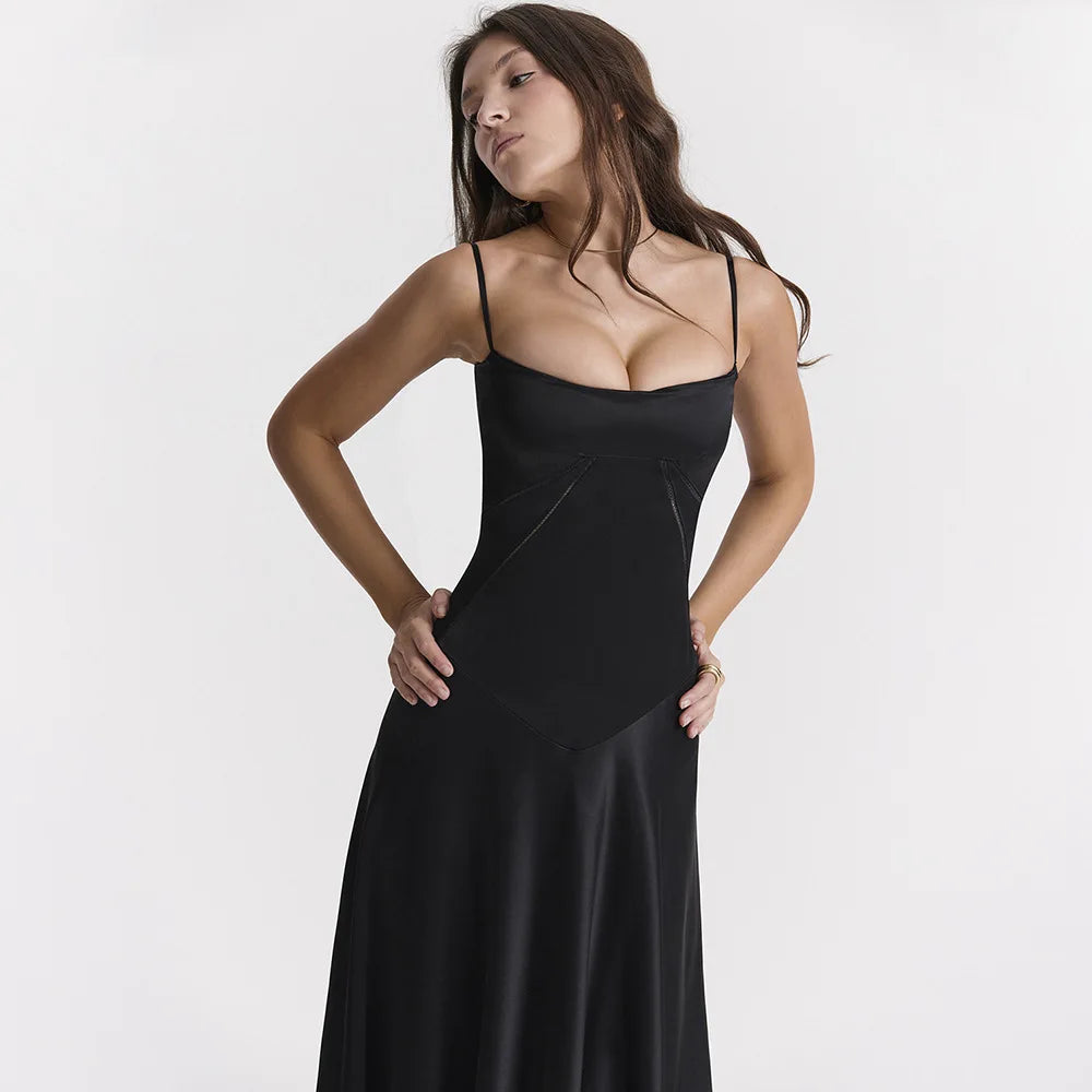 Woman wearing a black dress against a white background