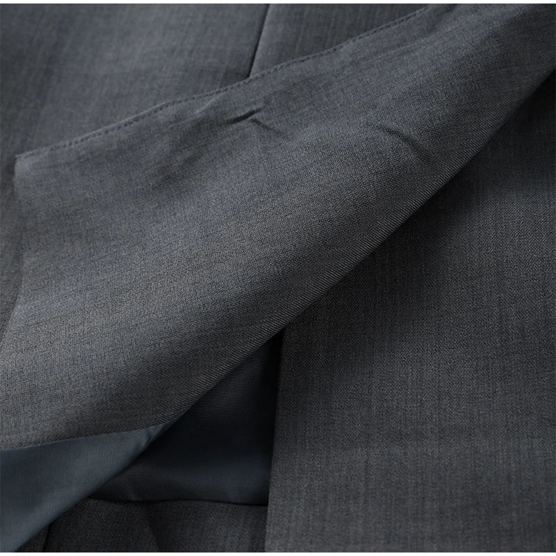 Close-up of dark gray fabric with a subtle pattern